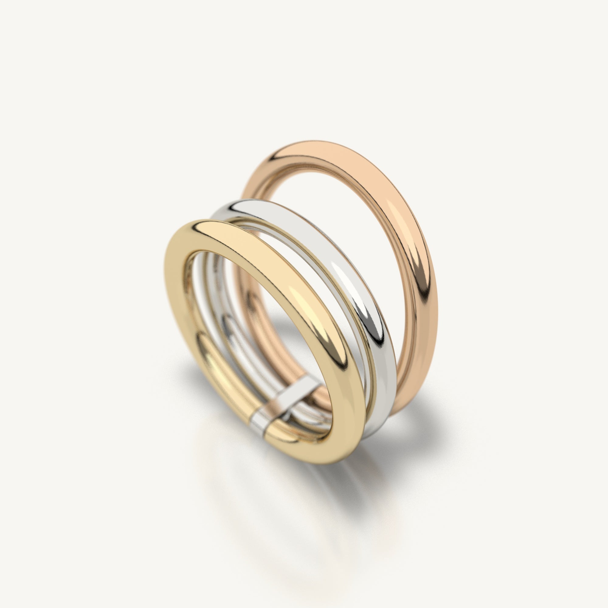 Trio ring from Inacio made from 18k recycled yellow gold, white gold, and rose gold